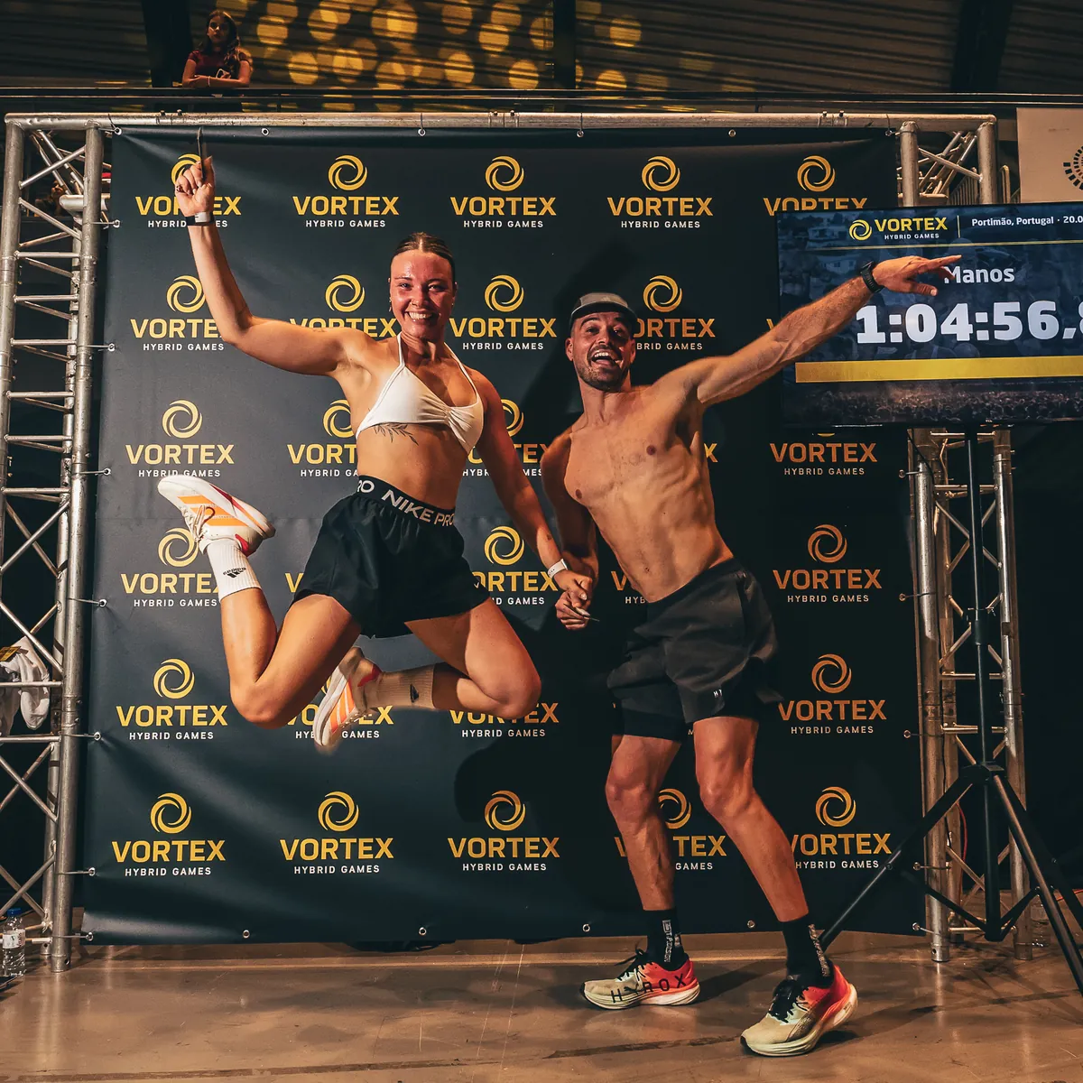 Athletes jumping at the finish board